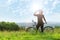 Â Sport bike woman , drinking on a meadow , beautiful landscape